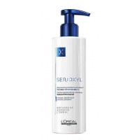 Serioxyl Очищающий и уплотняющий шампунь для окрашенных волос 250мл